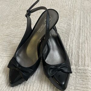Black 3 inch heels, pointy with bow.
